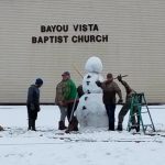 A snowman is created on the grounds of Bayou Baptist Church, Morgan City.