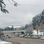 First Baptist Church, Pineville, is seen in the distance.