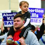 Marchers cross the Texas Street Bridge leaving Bossier City on their way to Festival Plaza in Shreveport for the Louisiana Life March North. Doug Collier photo