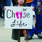 Madeline Lirette of Mooringsport walks to Festival Plaza in Shreveport during Saturday's Louisiana Life March North. Doug Collier photo
