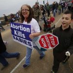 Participants in the Louisiana Life March CENLA travel down the Jackson Street Bridge. Doug Collier photo