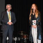 Jay Johnston, associate pastor of First Baptist Church in Covington, and Lauren Daigle face the crowd on stage at the Louisiana Governor's Prayer Breakfast.