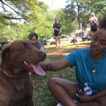 A Louisiana College student enjoys a break from final exams at the Paws Up event.