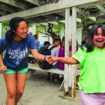 LSU student Catarina Kim shares a laugh with a resident of the special needs orphanage her team visited during a mission trip to Mexico.