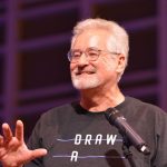 Student Freedom Summit organizer Tim Everett shares with the crowd the purpose behind the event. Everett is pastor of Open Door Fellowship in Springhill.