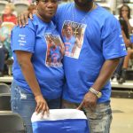 Family members of Clavoisiea Dupree, a member of the basketball team who was on pace to graduate with this classmates, stand beside a chair to honor him. On March 31 Dupree passed away. Brewer awarded Dupree with an undergraduate degree posthumously during the ceremony.