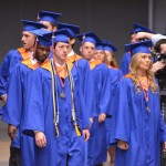 Graduating students file into their seats.