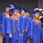 Graduating students file into their seats.