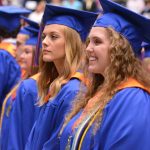 Graduating seniors look toward the stage moments before receiving their diplomas.