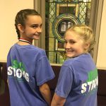 Fourth graders Sarah Albritton and Jordan Nielson enjoy a moment of laughter during the Louisiana Baptist State Children's Bible Drill tournament.
