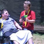 A Champions Camp participant receives instructions for how to play bazooka ball.
