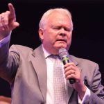 Louisiana College President Rick Brewer prays for God to move inside the newly renovated Guinn Auditorium.