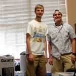 Students take a break from a busy day of moving into their dormitory.