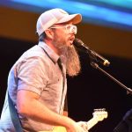 A member of the Cypress Baptist Church band from Benton leads a time of worship at PreTeen Invasion.