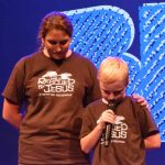 Jax, a youngster from First Baptist Church in Keithville, prays during a session of PreTeen Invasion. He opted to attend the event when faced with the choice of instead attending a football jamboree in south Shreveport.