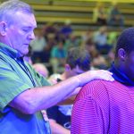 Tomorrow's Hope Crusade attendees pray during a time of invitation.