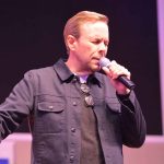 David Edwards prays during a LC chapel message. File photo