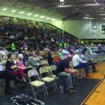 Several hundred people pack the Jena High School gymnasium for the first night of the Tomorrow's Hope Crusade.