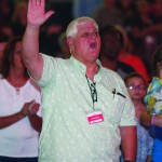 A man raised his hand during a time of worship.