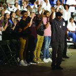 The audience at the Hope4U GO TELL Crusade participate in a time of worship.