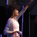 A member of the GO TELL praise team raises her hand in praise. Doug Collier photo
