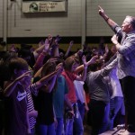 Evangelist Rick Gage leads students in a time of repentance for their sins at the Tomorrow's Hope GO TELL Crusade. Doug Collier photo