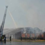 Crews battle a fire that engulfed several buildings at First Bossier December 10, 2018.