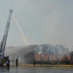 Crews battle a fire that engulfed several buildings at First Bossier December 10, 2018.