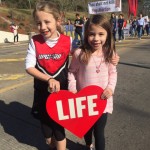 Two young girls enjoy the Louisiana Life March CENLA.
