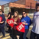 Louisiana Life March CENLA participants make their way down Main Street in Pineville.