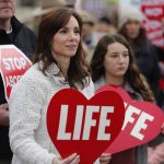 Right to life supporters march across the Long-Allen Bridge between Shreveport and Bossier City during the Louisiana Life March North.