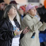 Supporters at the Louisiana Life March North lift their hands to heaven.