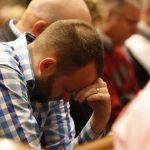 Brett Puckitt, pastor of the First Baptist Church, Vivian bows his head in prayer during the Call to Prayer at Broadmoor Baptist Church in Shreveport. Doug Collier photo