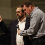 Calvin Hubbard, (L) Barksdale, says a Prayer asking for Repentannce and Renewal during the Call to Prayer IV at Broadmoor Baptist Church in Shreveport.
