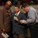 Chad Mills, Beulah Land, and Greg Shyne, United Outreach, pray during the Pastoral Prayer for One another during the Call to Prayer IV at Broadmoor Baptist Church in Shreveport.