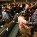 Guests gather together in groups of three to pray during the Call to Prayer at Broadmoor Baptist Church in Shreveport.