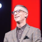 Ed Newton, pastor of the Community Bible Church in San Antonio, Texas, brings a message during Student Night at ECON.