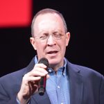 Don Pucik, newly elected association mission strategist for Northshore Baptist Association, prays at ECON.