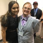 A special guest and his buddy share a smile at Night to Shine in Gonzales.