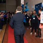 A special guest makes his way down the red carpet at Night to Shine at the Lamar Dixon Expo Center in Gonzales.