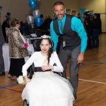 Fellowship Church Pastor Kirk Jones greets a special guest at Night to Shine in Gonzales.