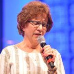 Janie Wise, women’s missions and ministry strategist for Louisiana Baptists, prayed during REAL.