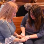 REAL closed with women praying that God would use them to stand for Christ in their communities.