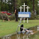 Three crosses atop a sign on Larto Baptist Church's campus remained unharmed in the wake of a tornado that touched down nearby. Facebook photo