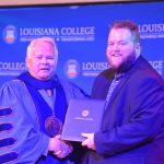Louisiana College President Rick Brewer presented diplomas to Sports Information Director Brad Welborn, who graduated during a special ceremony for members of the baseball and softball team.May 1, 2019. Brian Blackwell photo