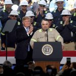 President Donald Trump applauds as worker Ronald Nunez speaks at the Cameron LNG Export Terminal in Hackberry, LA Tuesday while President Trump spoke in his effort to promote Energy Infrastructure and Economic Growth.