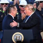President Donald Trump, right, is greeted by Sempra Chairman and Chief Executive Officer Jeffrey Martin, left, before speaking at the Cameron LNG Export Terminal in Hackberry, LA Tuesday in his effort to promote Energy Infrastructure and Economic Growth.