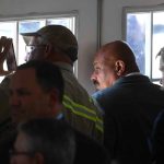 Workers strain to get a glimpse of President Donald Trumpas he arrives to speak at the Cameron LNG Export Terminal in Hackberry, LA Tuesday in his effort to promote Energy Infrastructure and Economic Growth.