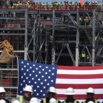 Workers line the rails on Train One as President Donald Trump speaks at the Cameron LNG Export Terminal in Hackberry, LA Tuesday in his effort to promote Energy Infrastructure and Economic Growth.