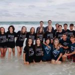 During a beach side baptism service, Cypress Baptist Church in Benton baptized 18 high school students and two adults.